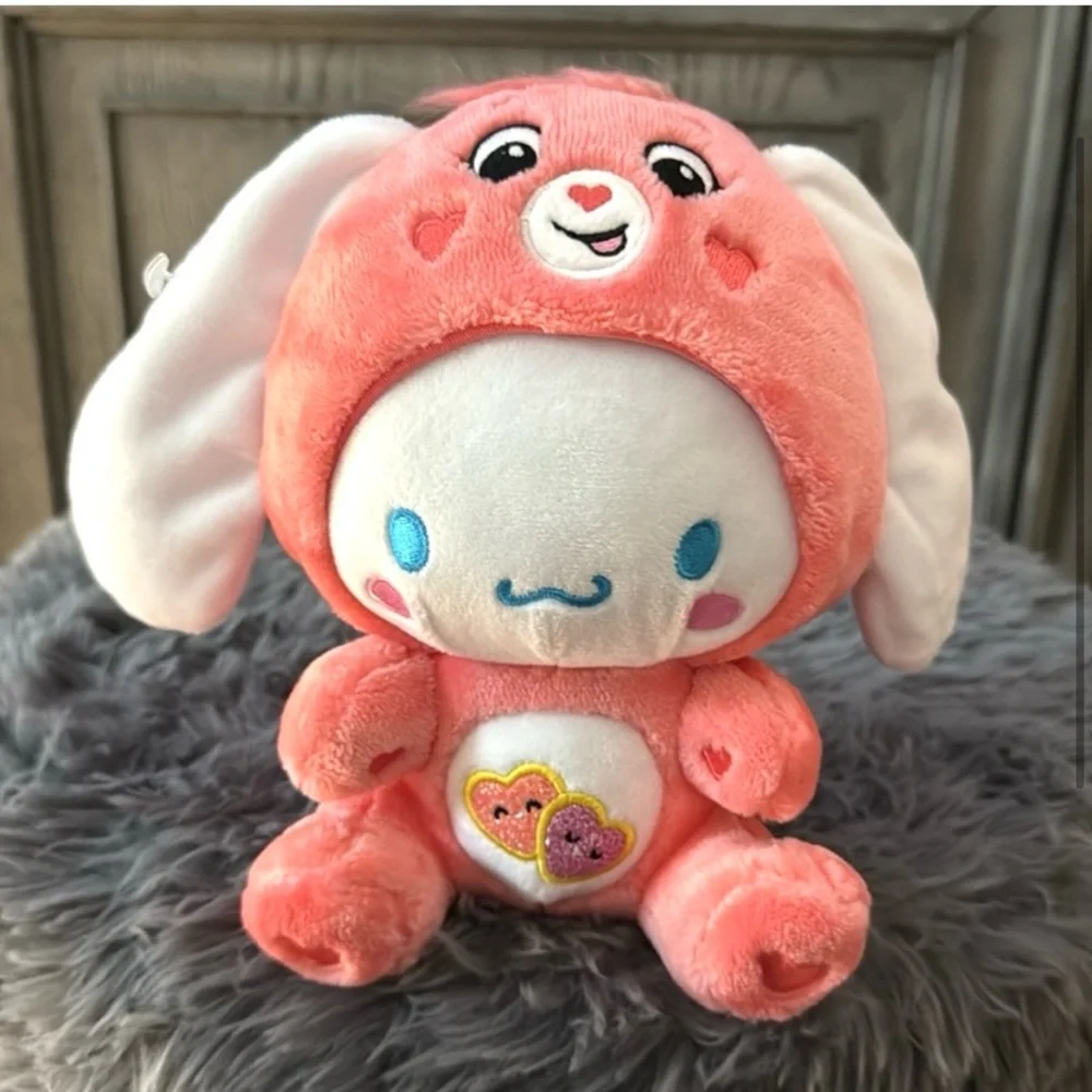Hello Kitty Cinnamoroll plush dressed as Love-a-Lot Bear Care. Ear collaboration